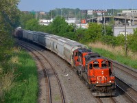 CN 4107 & CN 7266 head west towards Taschereau yard with the Pointe St-Charles switcher.