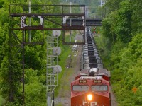 CP 551 with a single ES44AC (CP 8936) is heading towards a crew change at Ballantyne. He is passing an old set of signals and a new one on CP's Adirondack sub.