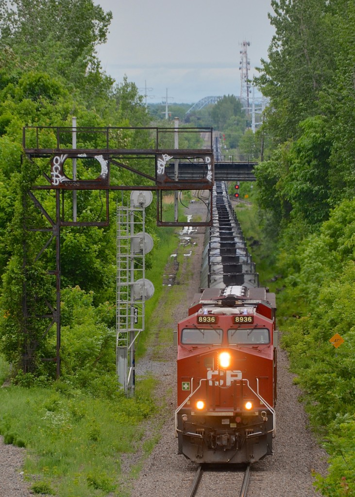 CP 551 with a single ES44AC (CP 8936) is heading towards a crew change at Ballantyne. He is passing an old set of signals and a new one on CP's Adirondack sub.