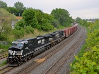A pair of Dash9's (NS 8941 & NS 9001) lead CN 529 through Montreal West in the rain.