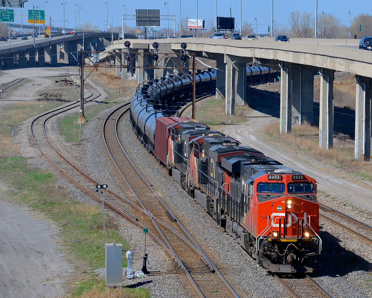 CN 704 (crude oil from Alberta for the Valero refinery in St-Romuald, Qc) has a trio of ES44DC's (CN 2333/2273/2236) as it slowly departs Turcot West after a crew change. They had to wait longer than usual to start pulling as CN 529, CN 324 & VIA 63 all were passing before the RTC could give 704 protection for the pullby.