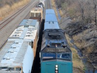 <b>Two westbounds.</b> At left is the rear of CN X321 and at right is VIA 59 with VIA 6458. Both are westbound through Lachine on CN's Montreal sub.