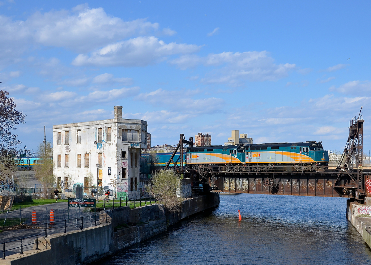 VIA 6412 & VIA 6442 shove the deadheading VIA 14 past Wellington tower on a sunny evening. At the other end was Park Car Evangeline Park.