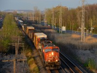 CN 5659 & CN 2193 lead CN 373 through Pointe-Claire with some nice evening light illuminating the train.