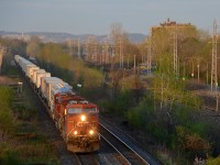 CP 8575 & 8783 lead the westbound Expressway through Pointe-Claire not too long before sunset.