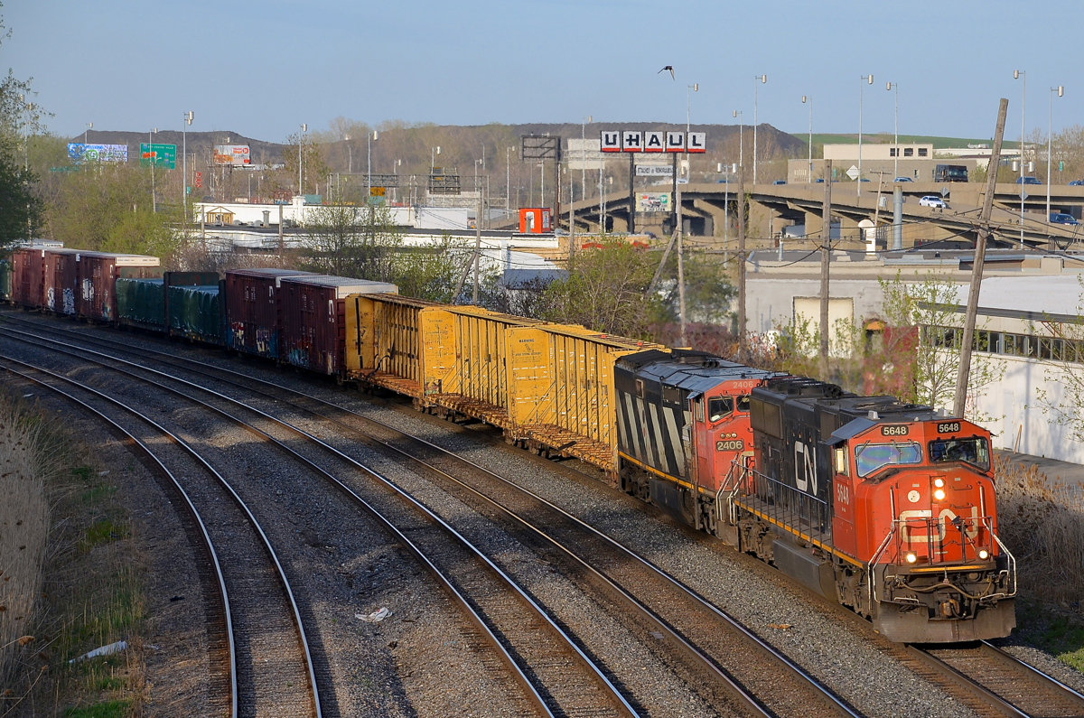 CN 5648 & CN 2406 lead CN 309 which is slowly picking up speed after a crew change at Turcot West.