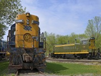 <b>A high hood and two end cabs.</b> CN 1382 (formerly CN 7300, and donated to Exporail a bit under a year ago) now has its correct numberboards and is out of Exporail's enginehouse after a winter spent stored. At left is ONR 1400, one of two MLW RS-10's to be preserved. Further at left part of POM 1002 (MLW S-3) is visible.