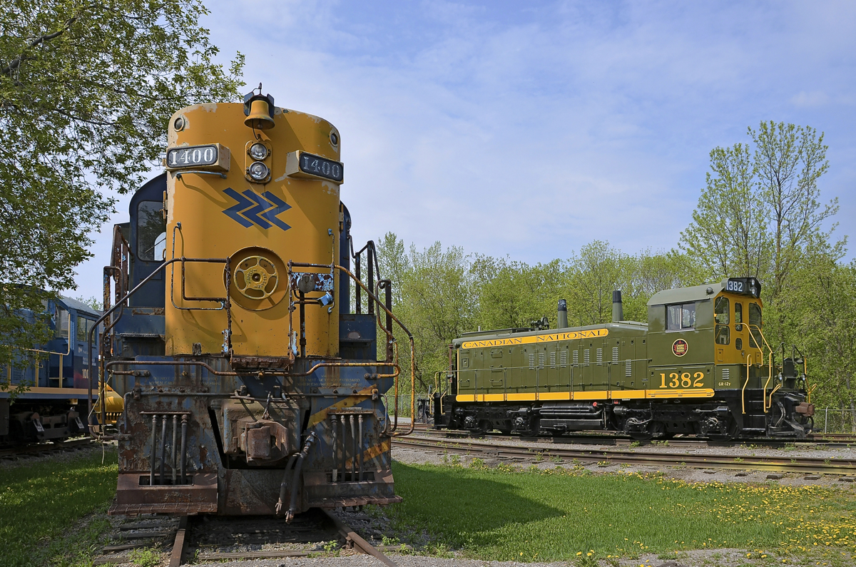 A high hood and two end cabs. CN 1382 (formerly CN 7300, and donated to Exporail a bit under a year ago) now has its correct numberboards and is out of Exporail's enginehouse after a winter spent stored. At left is ONR 1400, one of two MLW RS-10's to be preserved. Further at left part of POM 1002 (MLW S-3) is visible.