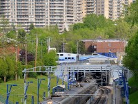 <b>Electric on one level, diesel on another.</b> In this shot we see AMT 945, an electric train for Deux-Montagnes stopped at Canora Station at the north end of the Mount Royal tunnel below. Above is CP's Adirondack sub, where AMT 187 for Saint-Jérôme is passing at the same time with AMT 1323 pushing.