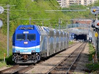 <b>In electric mode, finally!</b> Until the opening of the Mascouche line last December, AMT's fleet of dual-mode ALP-45DP's had operated 100% in diesel mode. With the opening of the Mascouche line, some of them are finally being used in electric mode (through the Mount Royal tunnel) followed by diesel mode for most of their run. Here AMT 1209 for Mascouche has just left Canora Station and is approaching Mount Royal Station with its engine (AMT 1364) having its pantograph up. The north end of the tunnel is visible in the distance.