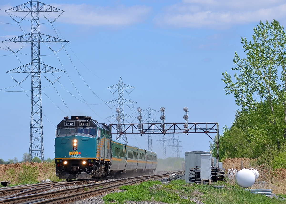 Formerly known as VIA 6403. VIA 6459 (ex-VIA 6403) roars through Coteau Ouest on CN's Kingston sub with 5 LRC cars in tow. Canada's new $10 bill features VIA 6403 and apparently VIA didn't want to take the chance of the real 6403 ending up in an accident.