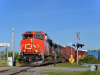 <b>Fresh off the business train.</b> CN 2271 is back in regular service after being washed and serving as the trailing unit on CN 600, a business train that operated from Sarnia to Montreal on May 13th. It is leading CN 326 (with CN 2570 trailing) as it leaves CSXT's Montreal sub and joins CN's Montreal sub at Cecile Jct. Note that the sign at right still lists Conrail as the operator. A CN crew took this train from a CSXT crew from Huntingdon, Qc after the CN crew brought CN 327 down from Montreal.