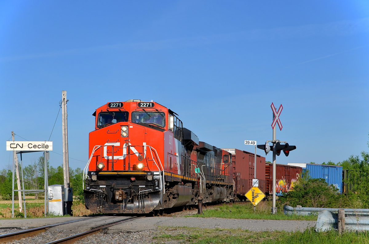 Fresh off the business train. CN 2271 is back in regular service after being washed and serving as the trailing unit on CN 600, a business train that operated from Sarnia to Montreal on May 13th. It is leading CN 326 (with CN 2570 trailing) as it leaves CSXT's Montreal sub and joins CN's Montreal sub at Cecile Jct. Note that the sign at right still lists Conrail as the operator. A CN crew took this train from a CSXT crew from Huntingdon, Qc after the CN crew brought CN 327 down from Montreal.