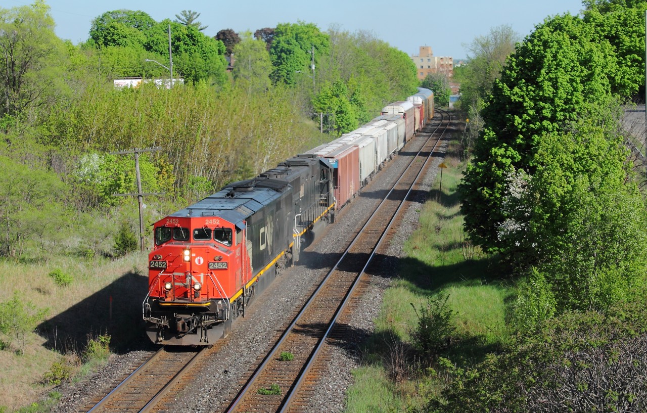 CN 435 throttles up out of Brantford with CN 2452 and IC 1010 providing the power on a lovely May afternoon.  I finished work at 5 and got a timely heads up that 435 was close to being done their yard work from a friend, so a quick drive over to the Brant Ave overpass worked out well.