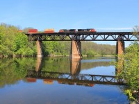 The eastbound all intermodal train #148 crosses the Grand River headed by 2524 and 8020.