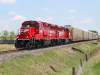 A very short all autorack train hauled by CP 2261 and 2264 at Gobles Rd crossing on its way to Pender.