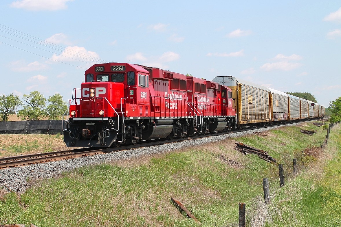 A very short all autorack train hauled by CP 2261 and 2264 at Gobles Rd crossing on its way to Pender.