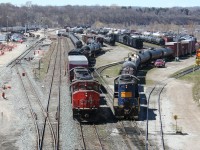 While RLK/SOR 4003 switches cars to the right, CN 4770 shoves its train of transfer cars from Aldershot yard into an arrival track at SOR's former CN Stuart Street yard in Hamilton.

The construction activity to the left is for new dedicated passenger tracks for expanded service on the line to Niagara Falls. Behind the photographer is a brand new construction for an extensive new passenger facility, ironically immediately adjacent to the location of the old CN Hamilton station.