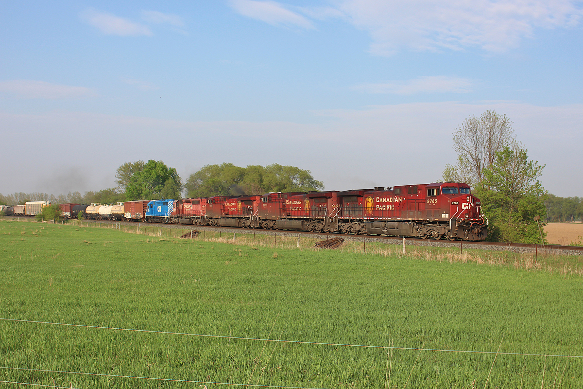 At only 1720 feet (or 19 cars), CP 246 has had no problem getting up to speed after dropping a few cars off at Utopia. For power is CP 9765, 9661, 9653, 6009 and CEFX 6537. 6009 and 6537 had gone through on 247 only yesterday, but was ready for 246 the next morning in Sudbury. 246's pathetic length will change at Spence, as its got many autoracks to pick up. Doing what a GE does best, 9653 in third looks like it's pulling the entire train. CEFX 6537, the reason I went to see this, is the only dead unit however. It will be dropped off at Spence. It will be interesting to see what CP decides to do with it. Performing the Honda Job at Spence is high on my list of wants, but I don't see CP using a leasing unit for yard power. Maybe though, who knows.