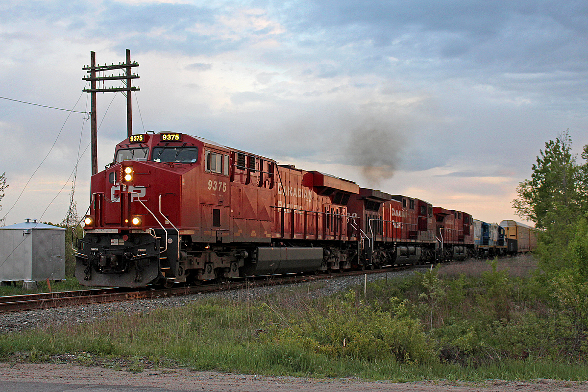 Every Monday and Thursday, CP 421 drops off a few cars at Utopia, and sometimes picks some up as well. This time it's picking up two ex RaiLink Geeps, CCGX 1755 and 1808. Owned by Cando, they spent the last couple of years at the yard in Utopia, presumably for spare parts to supply BCRY 1001, that delivers cars to CP from industries in around Barrie. However, these two units appeared mostly to be a display case to me at least. Well, their time to go has come, and CP 421 here gets ready to take them to Winnipeg. There, they will most likely join the deadline of CP GP9u's that are currently there, awaiting a buyer. My guess is anyone wanting these battered units is a torch, as vandals and rust have taken their toll on them. 1755's heritage dates back to the Pennsylvania Railroad from 1956 (nee PRR 7058). Meanwhile 1808's heritage dates to the Rock Island in 1960 (nee CRI&P 1334). They surely have seen a lot. It's too bad that road is likely at it's end.
