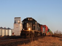IC SD70 1010 leads a early morning train past the town of Young Saskatchewan.