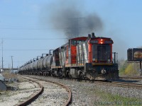 Seeing Arnold Mooneys photos of Quintessential GMD1's in the 80's posted today on rp.ca, makes you realize how lucky we are to have these 1st generation diesels kicking around considering their heritage. Let me set the scene - I was lucky to get this shot.<br><br>I'm on the QEW heading back from my Brothers, heading north, when I hear PRH on the radio talking to 547, who is calling for a light. 547: "YO we're looking to get out on the main, work at Burloak".  PRH: "And what is your lead engine number?" 547: "one triple four." PRH: "And your TIBS equipped". 547: "Yes we are". PRH: "OK to proceed on signal indication". Knowing what a TIBS equipped train meant (fast!) I had little to no time, I was just at the Fairview Rd exit. Getting off the QEW and heading straight to Burlington west, I set up for a shot. In no time I'm blasted with diesel exhaust, straight from the gut of these 567c powered engines, the non turbocharged throbbing of the 567 indicating quite clearly the pair have attained all 835 RPM their LaGrange  designers envisioned back in 1953. The kicker? 547 has yet to reach track speed, 40 MPH by me with 20 MPH yet to go. <br><br>So, it's 2015 and first generation diesels still roam the mainline on a class 1? A treat surely on borrowed time. Get your shots while you still can. LaGrange and GMDD London designers would be proud to know their products are still earning their keep nearly 60 years later.