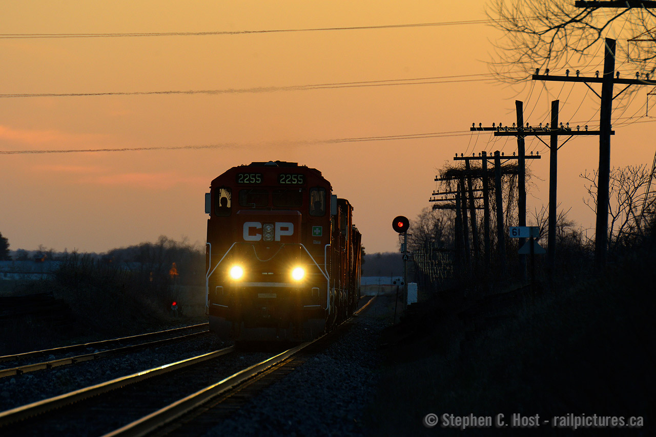 At dusk, T69 is racing east after working Ayr, next stop, Galt, and more work at Guelph Junction. Seems in the hurry to get out the crew forgot to turn on the headlight. Rumour is these signals will be replaced in the near future, searchlights on borrowed time, whom have seen everything from Steam to these third generation engines.