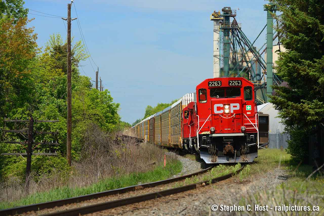 Two trains - This is train 247 - and also Train TH31. Pictured here, the Kinnear yard power is shoving (pushing) 247 up the Hamilton Subdivision mountain grade territory. The grade ends just beyond the power and this is where they normally cut off, on the fly.

As far as I can tell - any train over 2800 tonnes is likely to get pushers on the Hamilton sub (TrAM - Train Area Marshalling - this rule is likely specific to this grade) which means just about all Northbounds, except empty Ethanols and short trains get the pusher treatment.

Head end power was CP 8850 and CP 8564