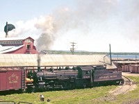 <br />
<br />
With her bell in full swing, Pacific-type #2218 works the yard at Consolidated Paper Corporation in Pembroke.  It looks like Del Rosamond has found another lofty perch for capturing an image on a hot summer’s day.  