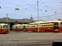 Toronto Transit Commission A-8 class PCC 4533 and two 4750-4779 series sisters (A-14 class ex-Kansas City cars) are pictured outside the Wychwood Car Barns (also known as TTC's St. Clair Carhouse) in September 1973. Built in 1914 by the Toronto Civic Railways, at the time of this photo regular operations out of Wychwood would last for a few more years before being moved elsewhere in 1978 following route consolidations. The facility served mainly as a storage yard for the TTC until it was sold to the city in 1996 (the last switches into the property were taken out of service two years later in 1998), and today has been repurposed as a community centre and park area for different events such as art shows, the summer Brewery Market, and other local events.