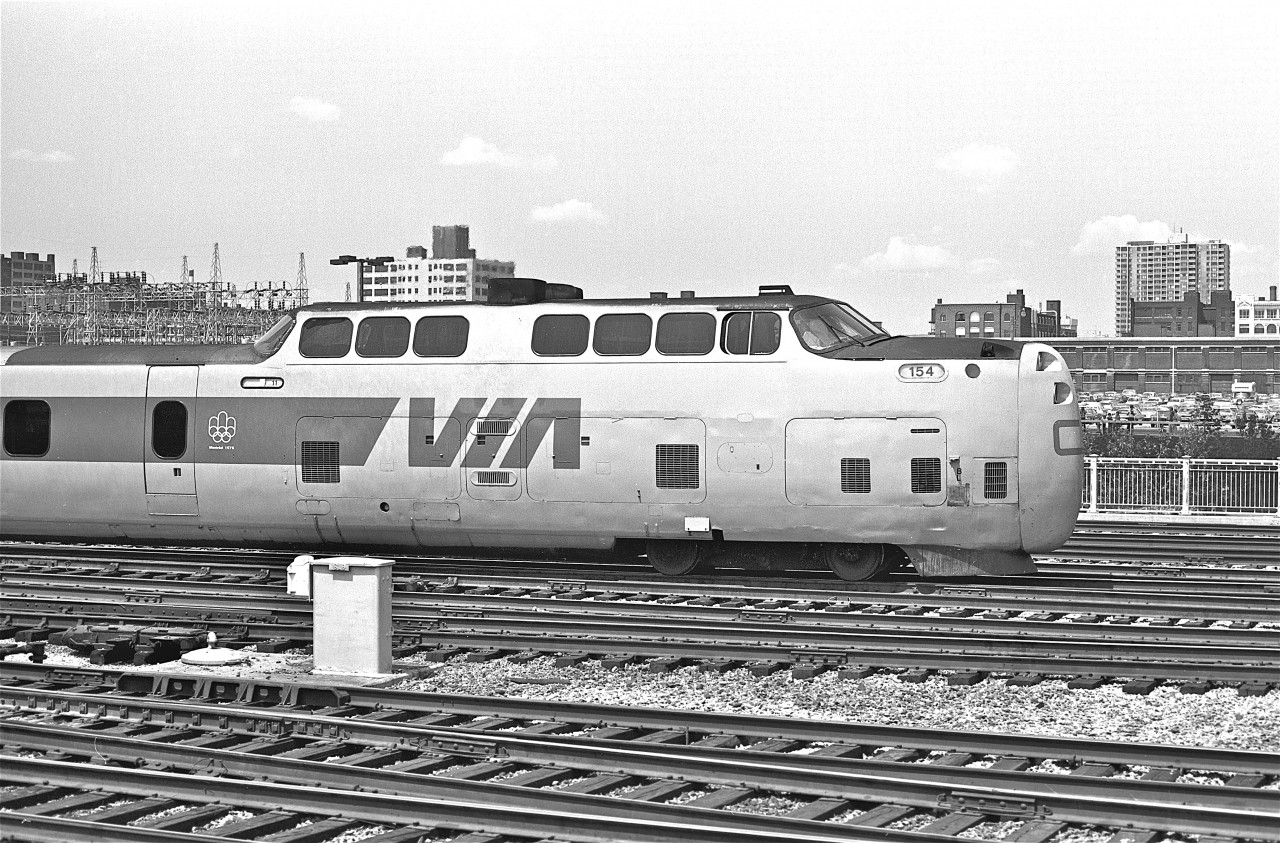 Sporting the symbol of the 1976 Montreal Summer Olympics, the Turbo train approaches Union Station.



After posting my last Turbo picture, Dave Tinslay wrote to tell me about an experience he had on the train.  With Dave’s permission, here’s his story…


“It must have been between 1972 (when I came to Montreal) and 1976 (when I got married).  I had very long hair with a Fu- Man-Chu moustache and big wooly sideburns.   So anyways, I went up to the 1st Class entrance of the train dressed in jeans - jean jacket - T-shirt and sneakers.  The attendant looked at me and in a very degrading voice said to me, "This is 1st Class buddy".   I showed him my ticket and he turned redder than the nose of the Turbo.   I told him, "I'm a railfan, not a bum".  So he took my bag and escorted me to the front seat.   When breakfast was served he served me first.  I didn’t act offended by his comment, but you know I had a big smile on my face the whole way to Ottawa!”