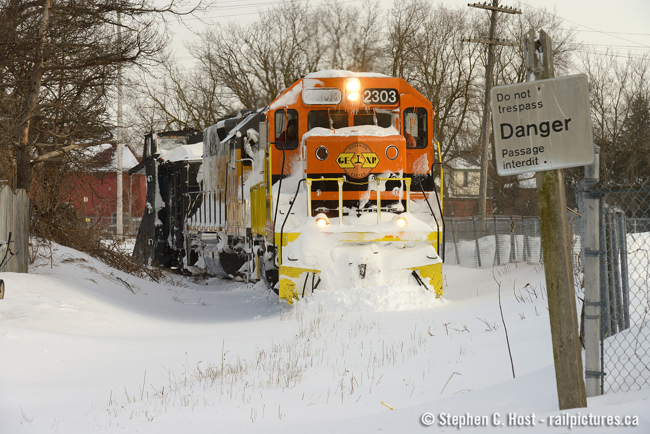 Brrr.. For those who enjoyed the  garden railway scene  - looking the other direction a couple winters ago, this Plow extra has ran to Guelph to wye and run back to Stratford. You can barely tell there is a right of way, save for the old CN no tresspassing sign.
This track was used not only by  RDC's to Palmerston, Southampton and Kinkardine from Toronto, but by unit oil trains from Montreal to Douglas Point (150 rail miles from Guelph). If only one could turn back time :) If anyone viewing this has some classic photos from the past - please consider sharing here :) Cheers.
