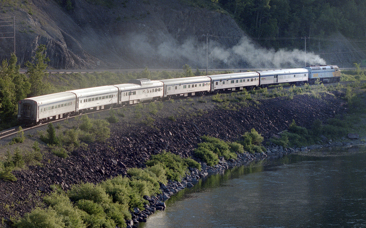 The Chaleur starts its journey to Gaspé along the north shore of the Restigouche River in Québec in 1999.  But soon after the train lost its name, then rail service was replaced by buses. But since since September 2013 all service has been suspended, although it still appears on VIA's website.  Perhaps one day....