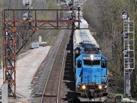 When they were both blue, GSCX 7362 and 7369 approach the Main Street N. overpass in Georgetown. Not long after this the old signals were removed to make way for a third track, to accomodate increased GO service.