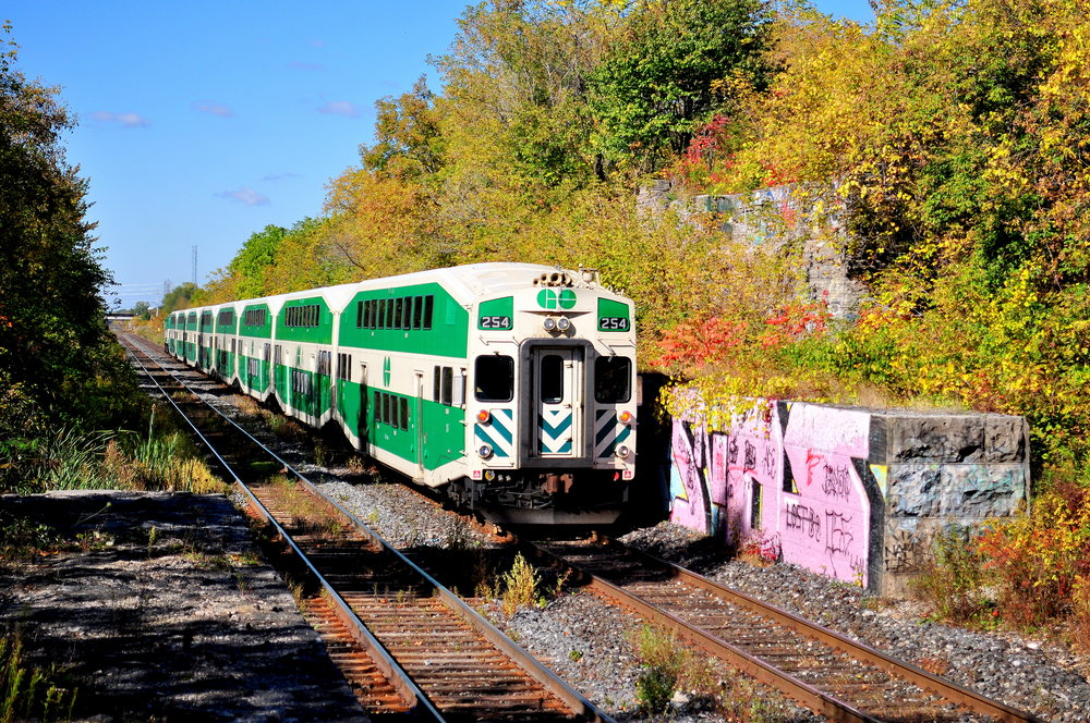 Along the Grimsby Subdivision is a hidden gem, the old CN Thorold Subdivision overpass. Little information is known about the bridge. It was used by CN on the back entrance line to the Merriton yard. It was removed in the mid 70's, and the supports have remained since. Slowly being taken back by nature, I suggest you take your pictures here while you can before it's no longer possible. On the still active (but just hanging on) Grismby Subdivsion, the Thanksgiving GO Special runs through, on the way back to Toronto.

Anyone who has information on this bridge is highly encouraged to post about it in the comment section.