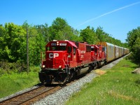 Two ex Soo engines, with shiny new paint jobs, lead CP 147 on its daily trek in to Puslinch. CP 6229 leads CP 6228 with a manifest of auto racks.
