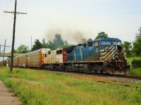 CP 147 slowed to enter the Puslinch siding, which got cancelled, then powers up to MM45 led by CEFX 1046 and SOO 6024 with a short load of auto racks as they pass under the Hwy 6 bridge on their way to Orr's Lake.