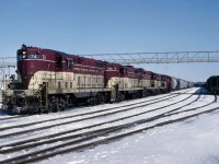 GP-7 TH&B 74 pulling a freight through the small yard in Port Maitland on the Lake Erie end of the railroad on Sunday, February, 28, 1982