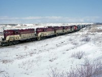 GP-7 #74 arriving into the end of the branch to Port Maitland with a sizable train on February 28, 1982.  The TH&B wasn't merged into the CP until 1987 but there was always the potential for mixed power evidenced by the RS-18 at the lashup.