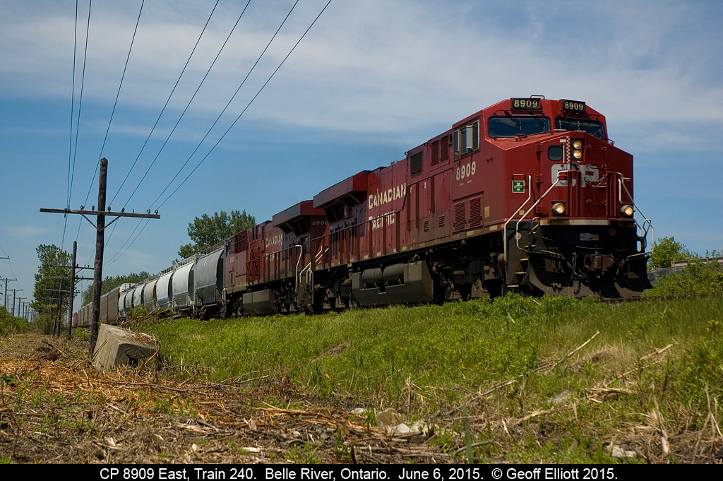 CP 8909 East, Train 240, is passing Belle River siding on CP's Windsor Subdivision with a clearance to Tilbury.  As you can see CP has been doing some significant weed/brush cutting here which has allowed for some new views which I hope to use as much as possible before it grows back over.  My back yard is just behind the trailing unit to the right, so at least I don't have far to go....  :-)