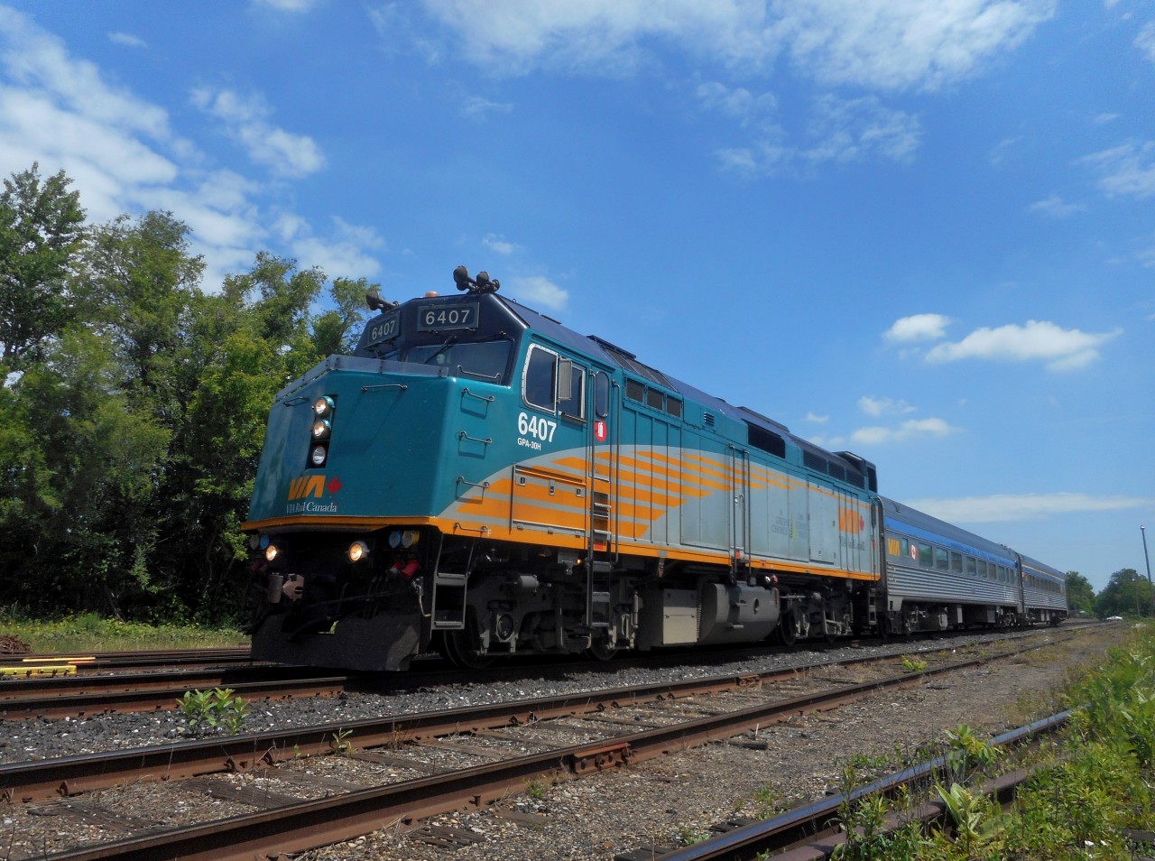 VIA 6407 leads train 85 through Guelph at mile 49.79.  The time is 12:10, and train Goderich Exeter Railway train 580 (switcher from Kitchener) and 582 (switcher from Preston) have both just departed the area, at about 12:02.  This is a great place to get a train meet.