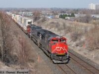 Class leader CN 8000 leads BCOL 4651 and an unidentified GP9 eastbound at Whitby.