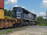 Working 105's train solo, CN 8101 leans through the sharp curve and crosses McCowan Road on it's way north. In a very short stretch, the Canadian Northern, builder of the Bala Sub, saw fit that a northbound train will do a fair bit of twisting and turning in order to keep a reasonable grade up the Oakridges Moraine. 1249hrs.