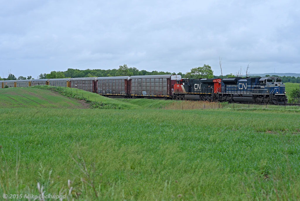 I simply cannot let that Host character outdo me, here's CN 8103 leading 422 at Ash, a little south of Milton. CN 2868 trails, making it a two builder, all-AC traction consist; not the easiest thing to catch on CN. Eastside showing the westside fools how it's done :P 1337hrs.