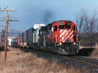 In the mid 90's, much to the delight of guys like me, the power-short CP was leasing everything they could get their hands on. Here is an example: Westbound about to roll under the Hwy 6 bridge at Puslinch is CP 5836, HATX 501 and VIA 6452. Photo taken late afternoon.
