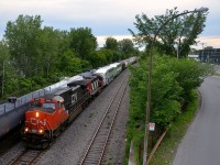 CN 2664 & CN 4140 lead CN 527 eastbound past CN 309 which is stopped after the hot box detector said there was a hot box on the train. CN 527 has two GO Transit coaches at the head end (2036 & 2434), the former in primer paint.