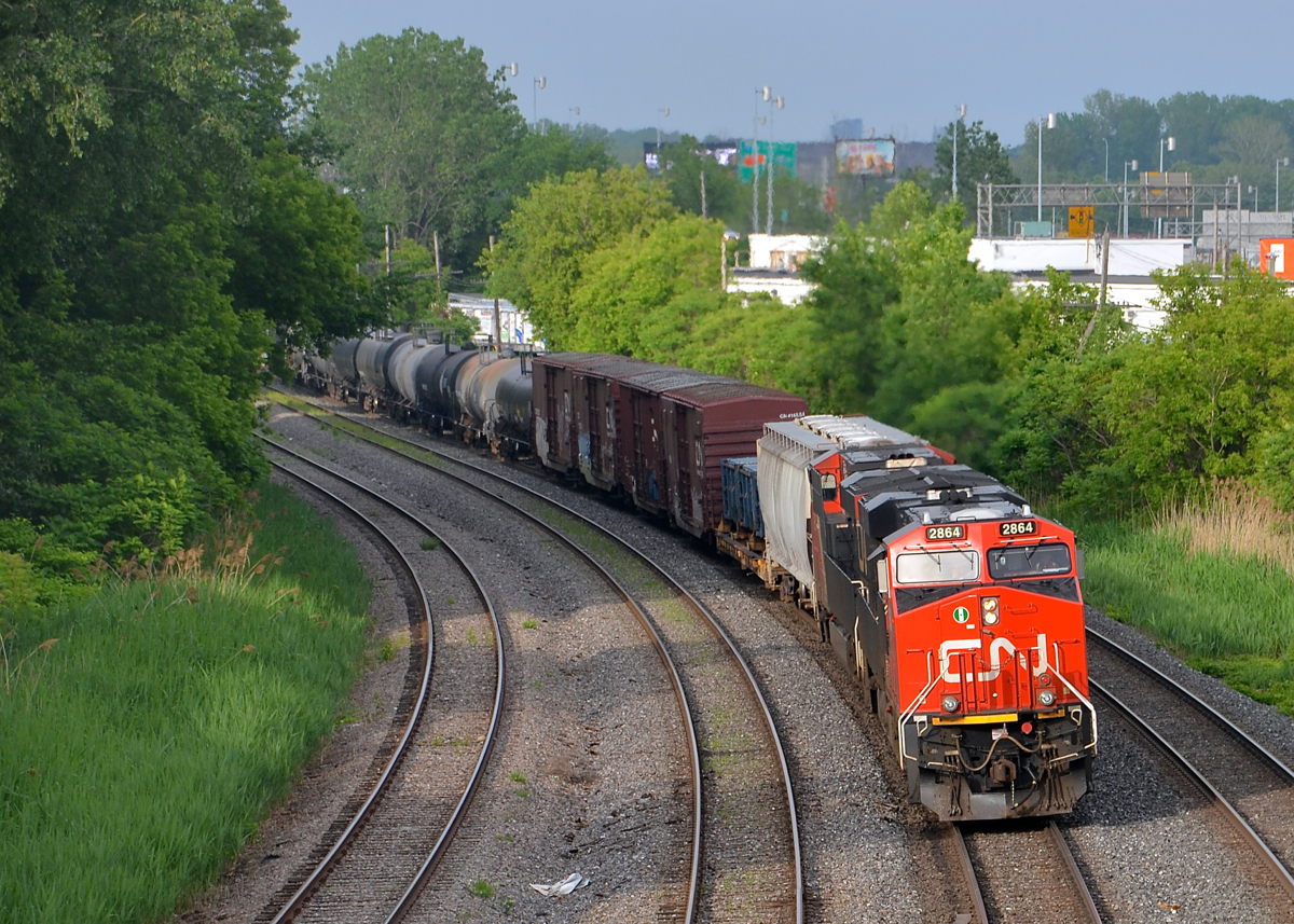Some sun at the right time. CN 2864 & CN 2860 lead CN 309 away from a crew change at Turcot West on a mostly rainy day. Thankfully the sun came out for a few minutes when CN 309 passed through Montreal West.