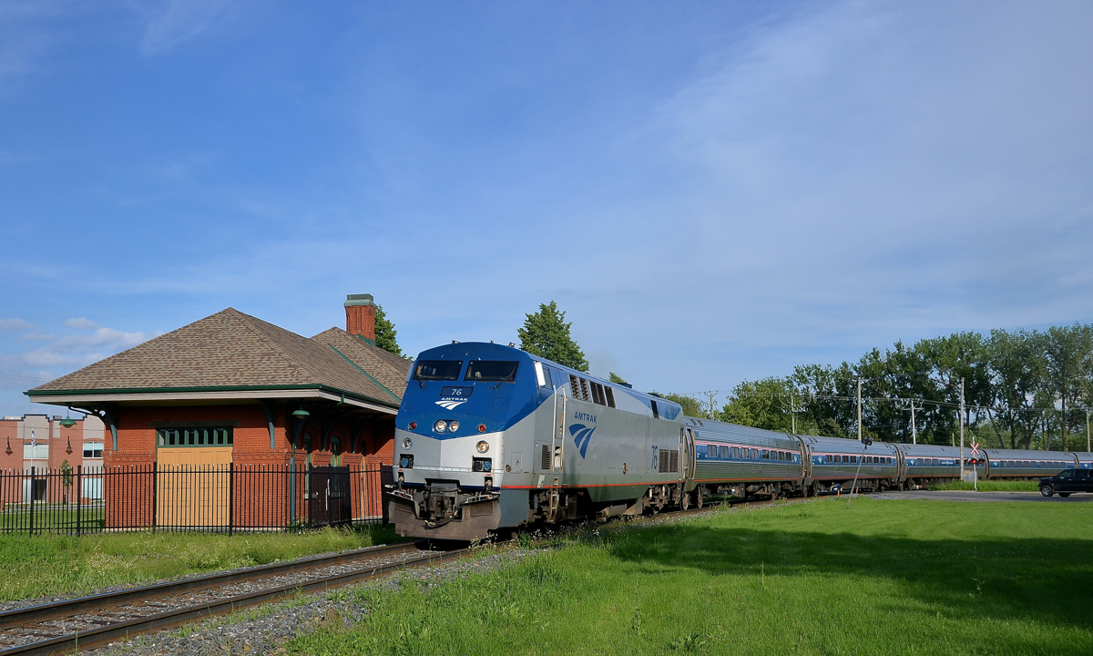 The northbound Adirondack sweeps around the curve in front of the old Grand Trunk station in St-Jean-sur-Richelieu this evening.