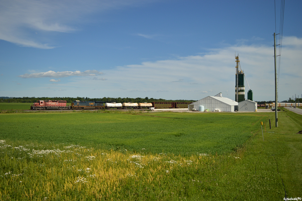 CP 6009 North highballs through Baxter with a short 2400 ft train (31 cars) and an American visitor (CSXT 997) after about an hours worth of work at Spence due South of here. Currently only cleared to Buckskin, the RTC would eventually superseed them right into MacTier for a straight shot!