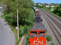 <b>Head on on the transfer track.</b> CN 527 has an SD70M-2 leading a pair of GP9's (CN 8935, CN 4140 & CN 7224) as it heads west towards Taschereau Yard on the transfer track.